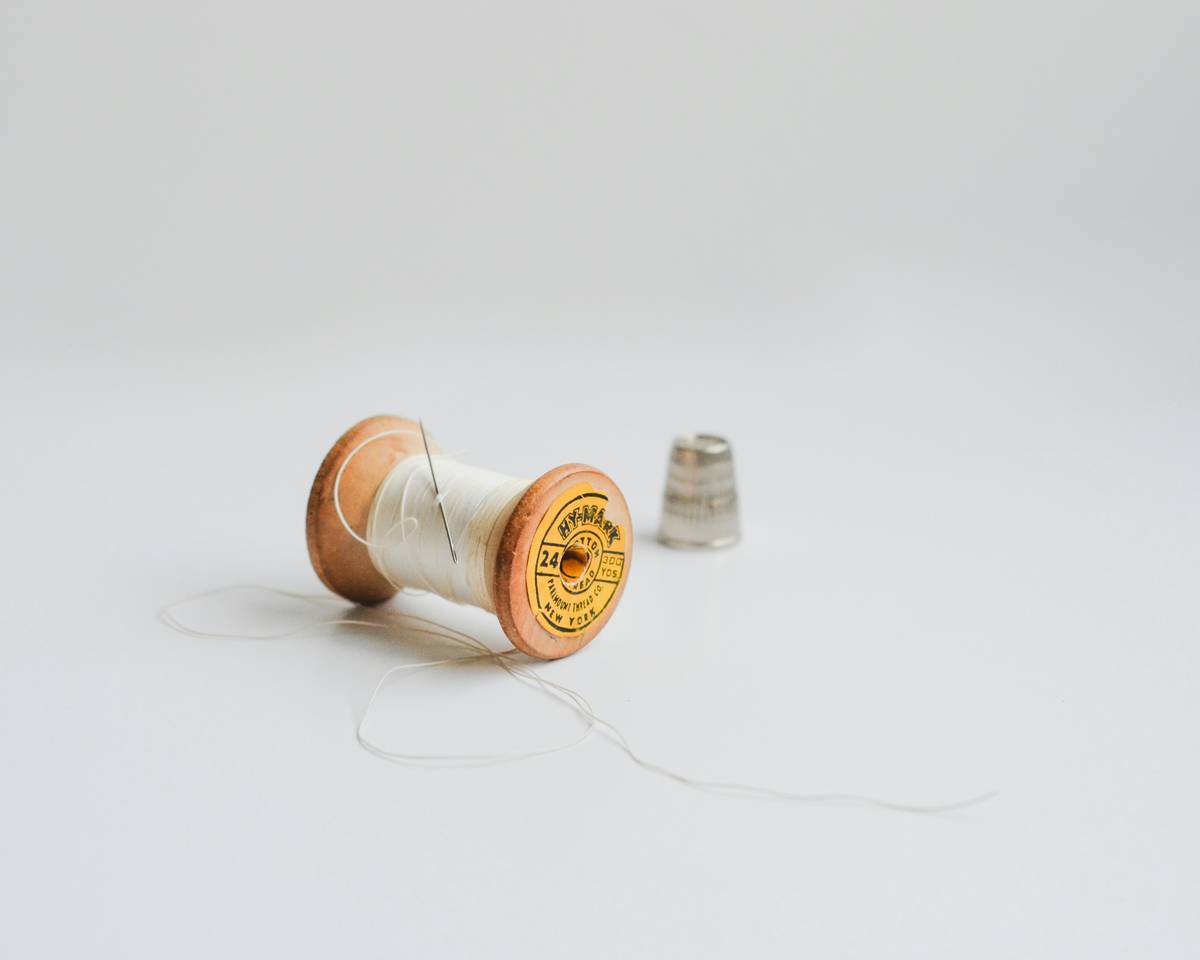 Close-up of brass garden hose to garden hose connector with Teflon tape applied to threads